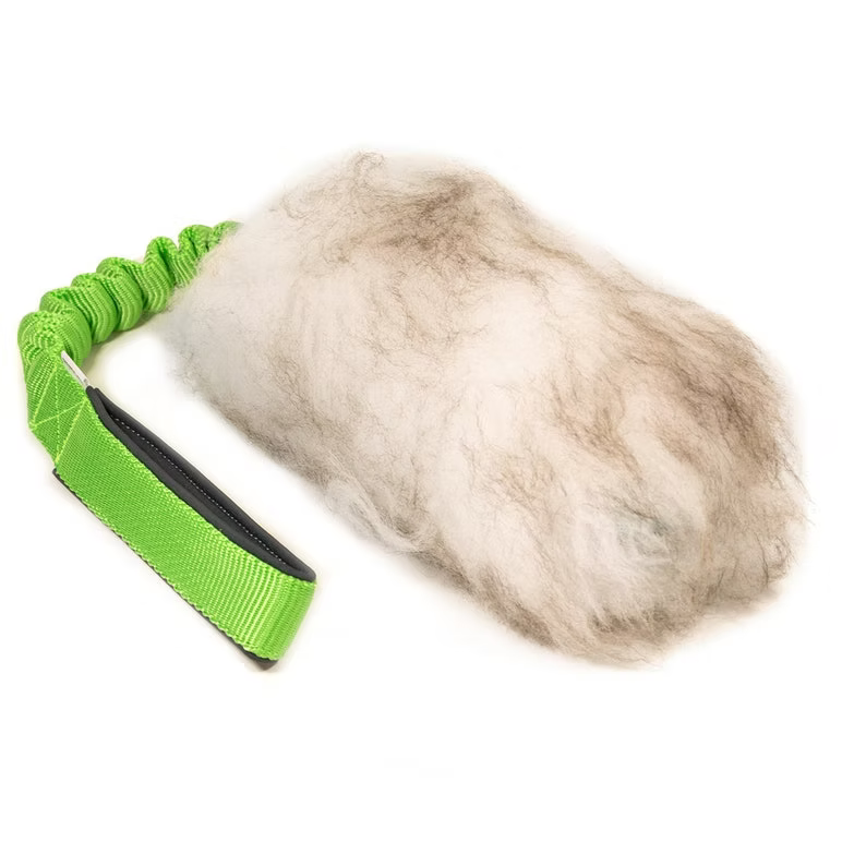 a pricture of a dog toy for tug of war game, with real wool and a bungee green short handle