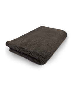 Folded dark gray towel on a white background
