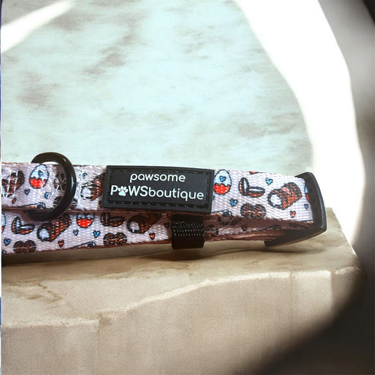 Dog collar with a patterned design and visible brand label on a light background