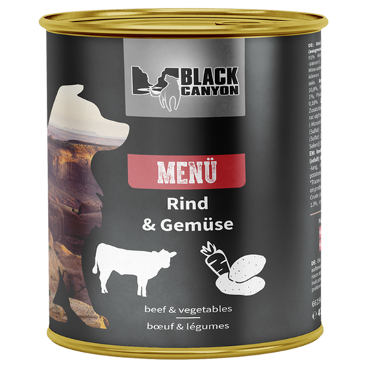 a can of dog food black canyon menu with beef and vegetables

