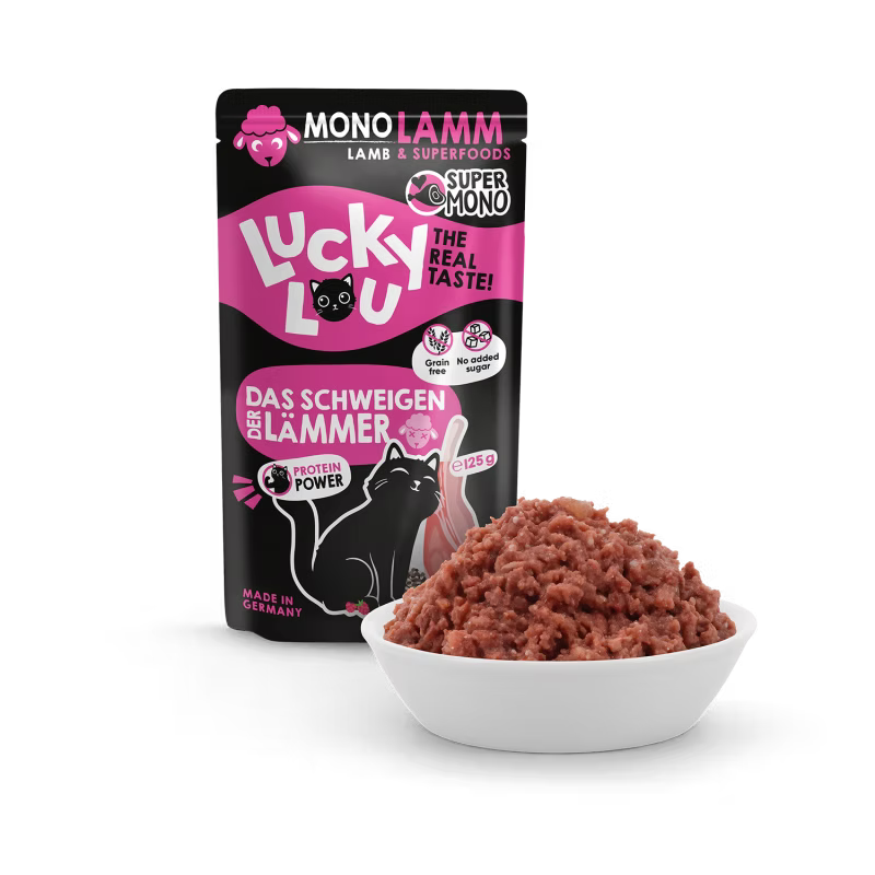 a pouch of cat food lucky lou lamb on black background