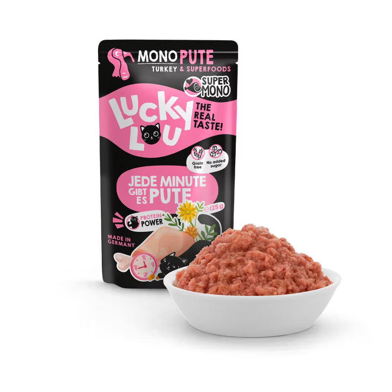 a pouch of lucky lou cat food with turkey on black background