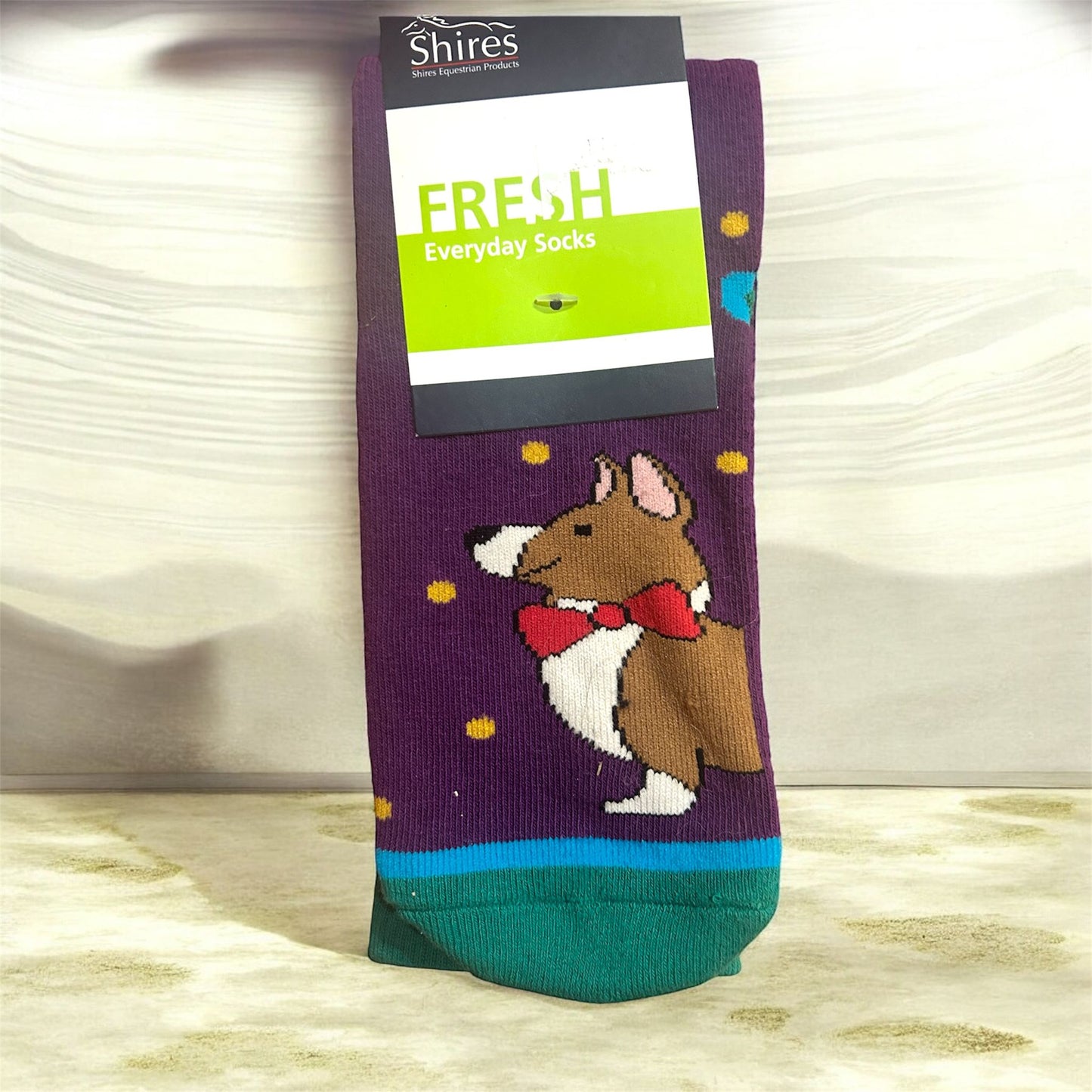 Sock with dog design and 'Shires' branding on a white background