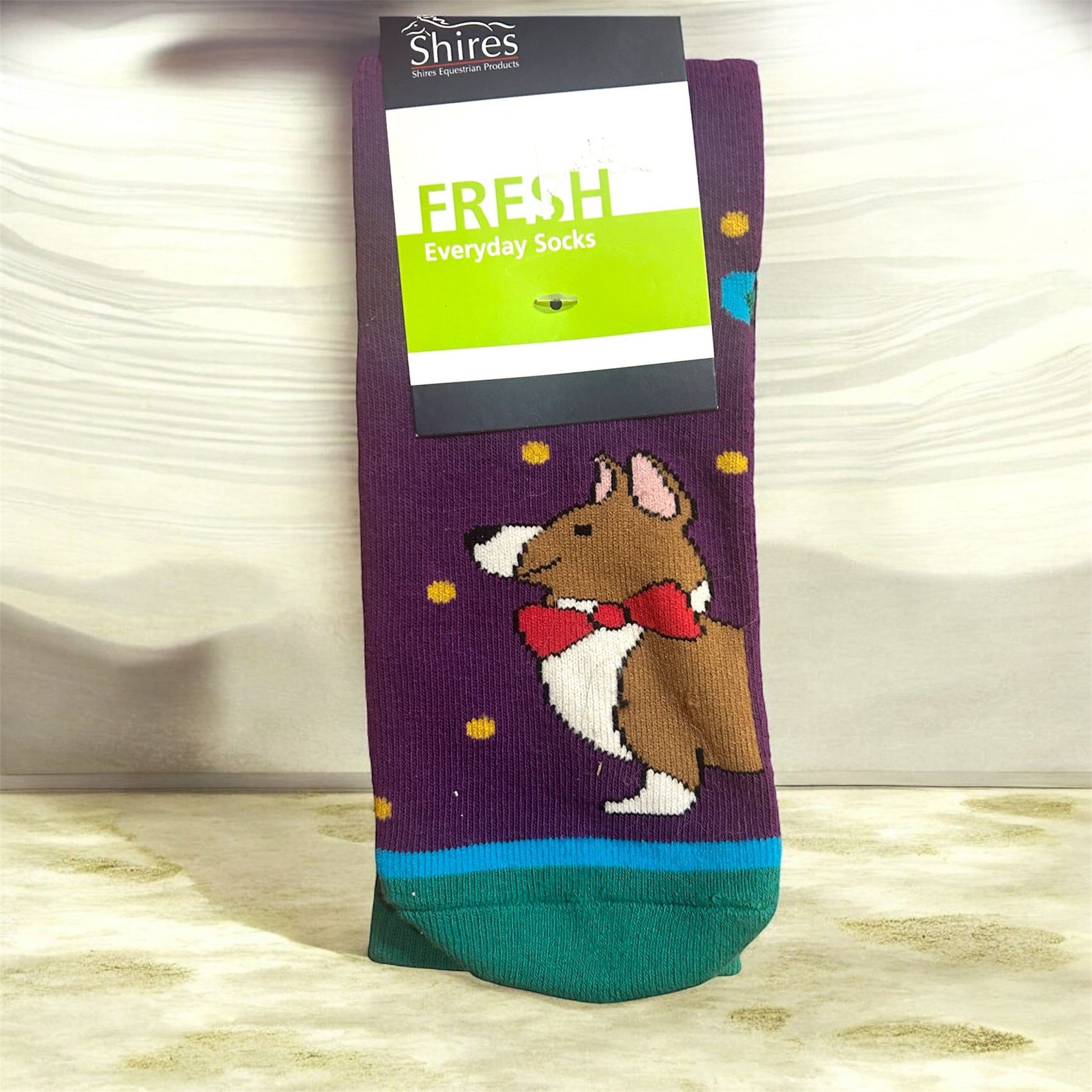 Sock with dog design and 'Shires' branding on a white background