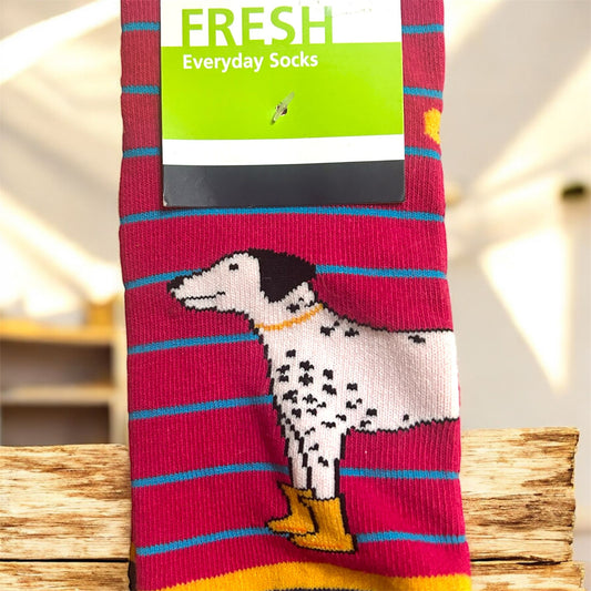 Sock with a dog design and 'Fresh' brand label on a wooden surface