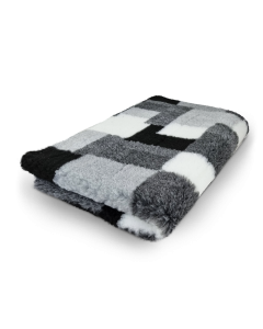Checkered blanket with black, white, and gray pattern on a white background