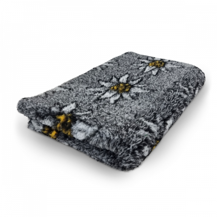 Floral patterned blanket with bees on a white background